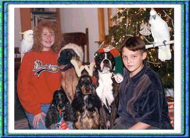 Louie at home with Michele Verrrall's two childred Holly and Rob and their birds and other dogs. 